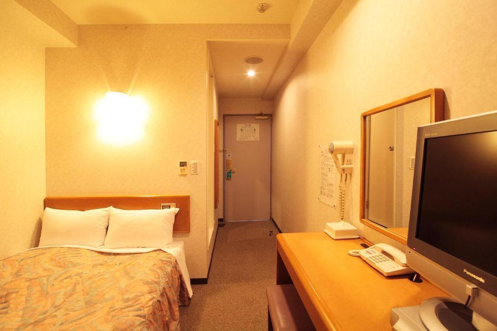 Hotel New Budget Sapporo Værelse billede